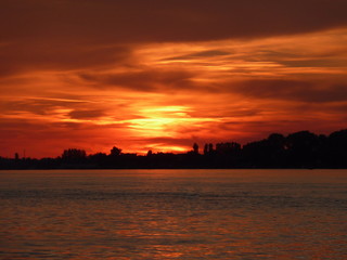 Naklejka premium Sunset with colorful sky and clouds on the river Danube in Novi Sad, Serbia