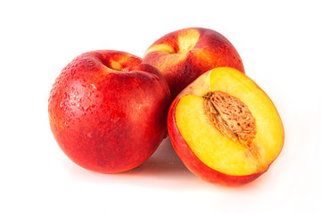 Fototapeta na wymiar Peach or nectarine and peach slice with leaf on white background