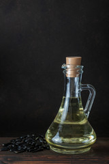 Obraz na płótnie Canvas Bottle or jar of sunflower oil on wooden table