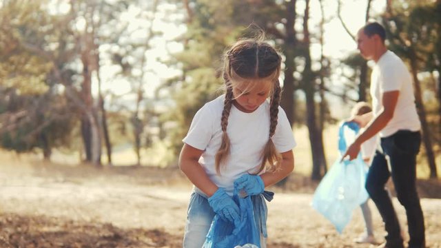 kid collecting trash volunteer teamwork. child group happy family on collects garbage plastic trash waste bottles trash. environmental happy family ecology a teamwork volunteer awareness pollution