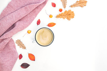 Cup of coffee, women scarf, autumn leaves on white background