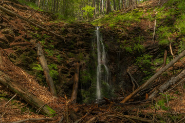 Waterfall near Kouty nad Desnou village in summer day