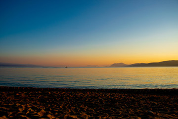 Beautiful sunset over the sea on Agia Eleni Beach, Skiathos, Greece