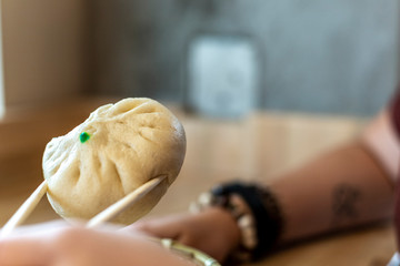 Steamed Bao Bun with chopsticks