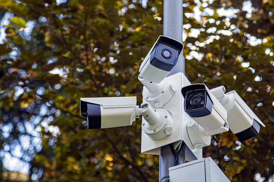 Lamp post with lots of CCTV cameras. Surveillance and modern city security concept.