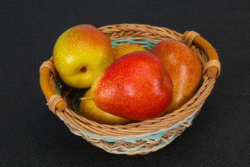 Pear heap in the wooden basket