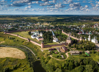 Panoramic aerial view of ancient city Suzdal and Saviour Monastery of St. Euthymius at sunny day. Golden ring of Russia, Vladimir region. Aerial drone photo.