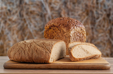 wheat and rye bread on a background of straw