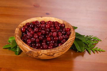 Cranberry in the wooden bowl