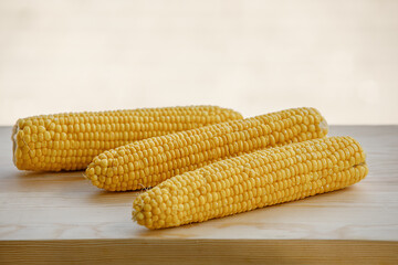 Close up group of corns on wooden table.