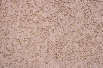 Pink decorative relief . Pink stucco wall. Pink background of the wall.