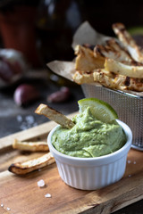 Guacomole sauce with celery fries  