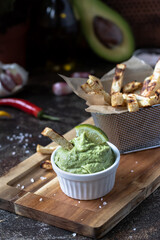 Guacomole sauce with celery fries  