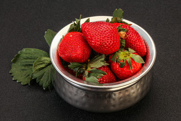 Ripe sweet strawberry with leaf