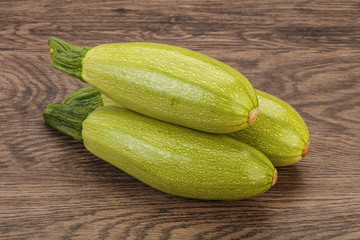 Young tasty zucchini over board