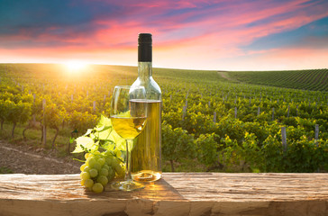 A fresh chilled glass of ice wine overlooking a Canadian vineyard during a Summer sunset - 371047489