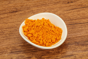 Tumeric powder in the bowl