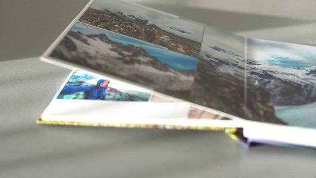 Page Turning photobooks on the table at home