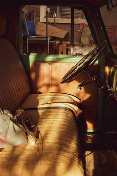 Classic Willys old car green front seat and steering wheel closeup. Vintage concept.