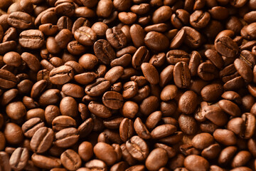 The whole background is covered with large coffee beans