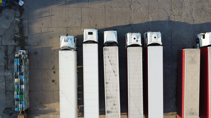 View of trucks from drone. Logistics and warehouse. Trucks at base. Transport. © Mateusz