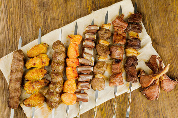 skewers with different kinds of meat and dough