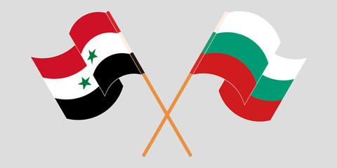 Crossed and waving flags of Syria and Bulgaria