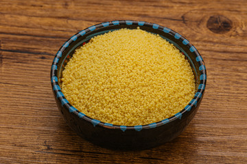 Raw cous cous heap in the bowl