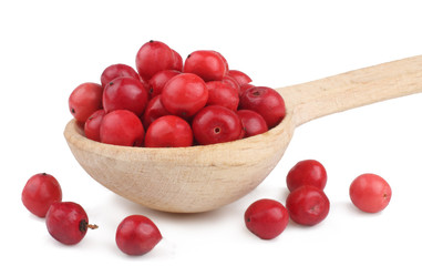 Red pepper peas in the wooden spoon isolated on white