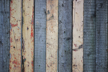 Wooden background from boards of different colors with abrasions. Wood texture.