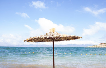 straw umbrella  on the beach