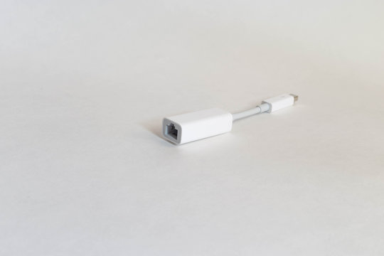 Computer Adapter Allowing Laptops With Thunderbolt Connector To Connect To Ethernet Network Cable.