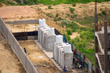 Fototapeta premium Men flock to communal toilet in teh morning for bath and defecation in a rural indian village