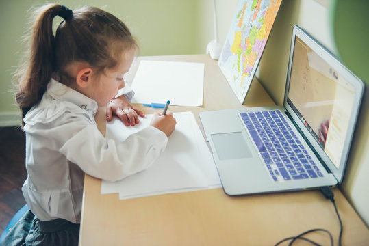 School girl  is studying online. Home schooling. Distance education. 