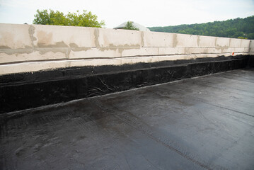 the terrace is covered with a layer of waterproofing roofing material