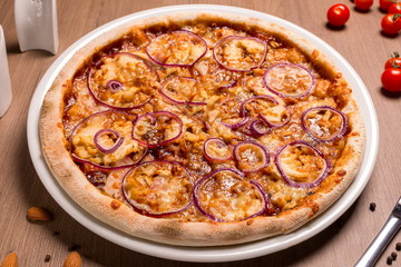 Barbecue pizza thin cake, BBQ sauce, chicken fillet, bacon, mushrooms