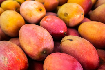 red stacks of mango fruits