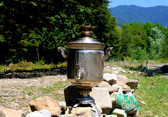 Vintage metal copper tea samovar. Samovar side view. Retro soot grunge tea samovar. Ancient Azerbaijan samovar. A device for making tea.
