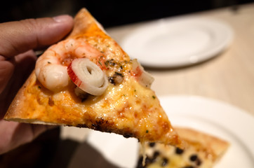 eat a piece of pizza