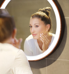 Magic anti-aging cream.Applying the cream.