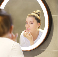 Magic anti-aging cream.Applying the cream.