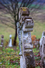 Graves with crosses in an abandoned cemetery