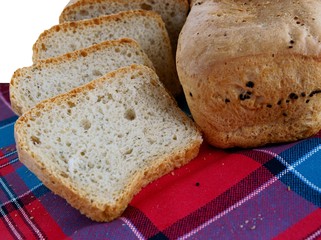 loaf and slices of homemade tasty bread