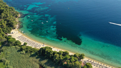 Fototapeta na wymiar Aerial drone photo of popular paradise turquoise beach of Vromolimnos with small swamp next to it, Skiathos island, Sporades, Greece