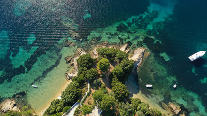 Fototapeta na wymiar Aerial drone photo of popular paradise turquoise beach of Vromolimnos with small swamp next to it, Skiathos island, Sporades, Greece