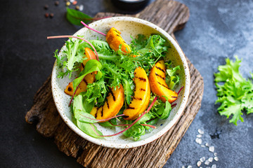 grilled peach salad lettuce leaves mix nectarine ingredient natural product portion serving size healthy top view place for text copy space keto or paleo diet raw