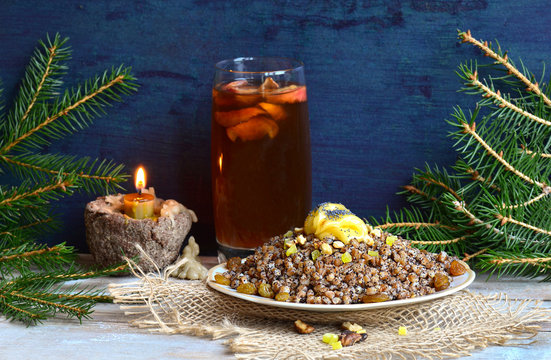 Sweet pilaf with dried fruits. Plate with kutia with dried fruits.
