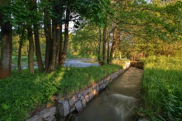 The beginning of the mill race at the weir. East Moravia. Czechia. Europe.