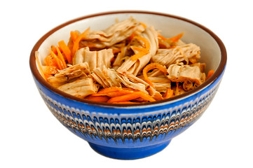 Spicy Chinese or Korean Yuba (tofu bamboo) and carrots salad on white background. Food product made from soybeans. Selective focus.
