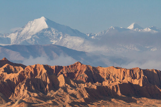 Snow capped mountains and geological formations in the Issyk Kul Lake area, Kyrgyzstan
